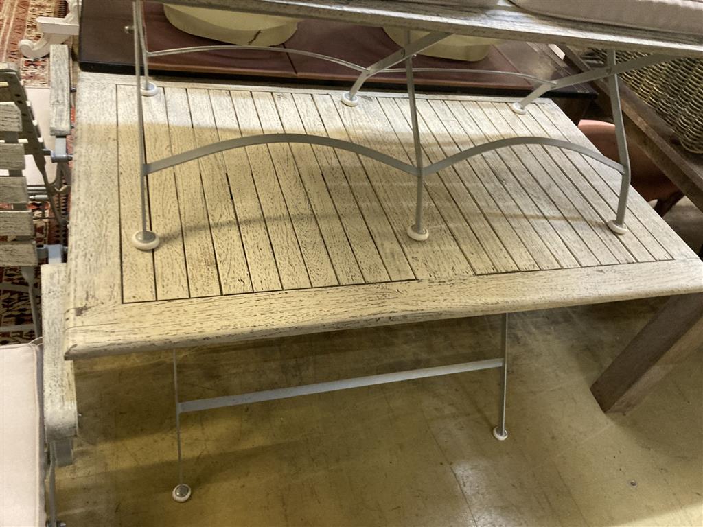 A modern painted slatted wood and metal garden suite of folding table, width 120cm, depth 72cm, height 75cm, bench and a pair of elbow